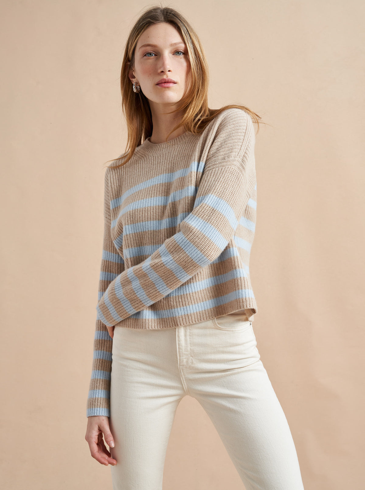 This is it. This is your everyday, never-without, take-with-you-everywhere sweater that will always have your back. Deliciously ribbed cashmere in a loose crewneck and slightly cropped silhouette means you need one in every color for tous les jours. 