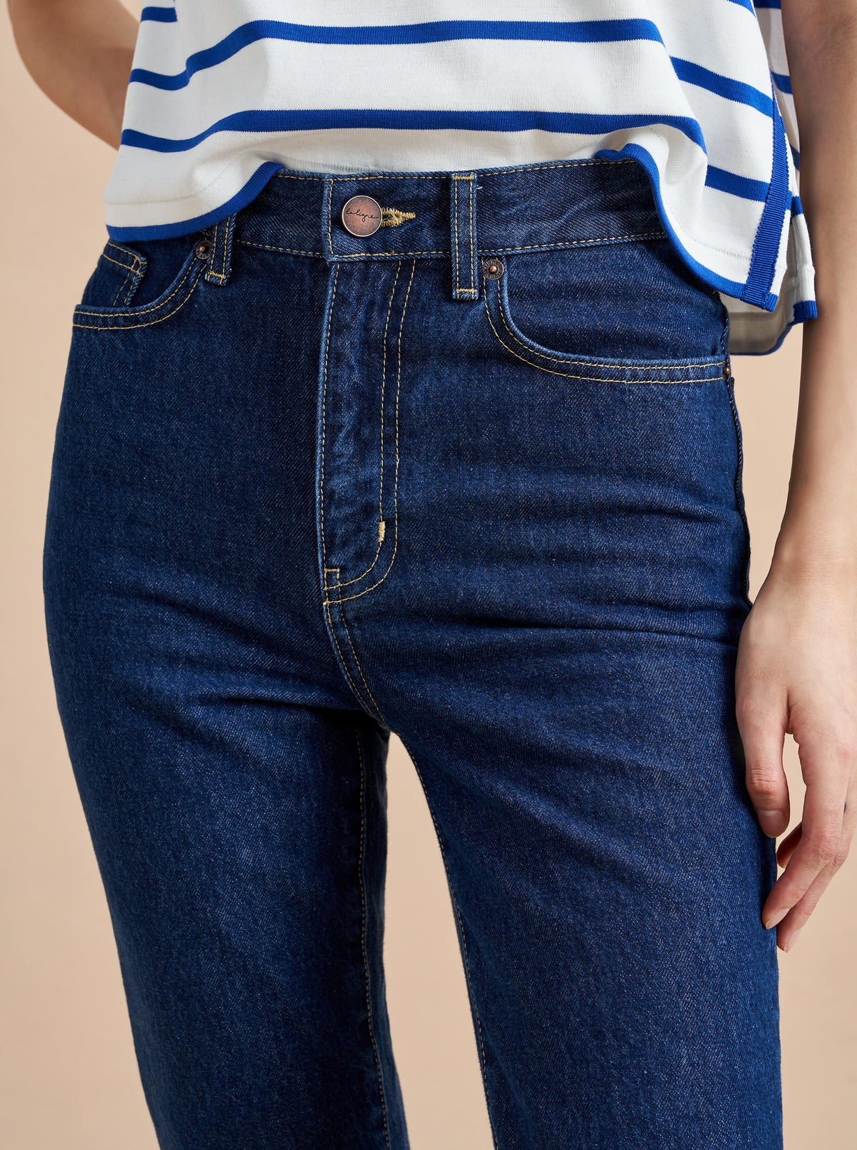 The classic, high-rise, non-stretch, straight-leg jean that gets better after each wear, never goes out of style, never disappoints and you can never get enough of, AKA The Molly jean or The Mom Jean, aptly named after our co-founder that will take you from 9 to 5, after hours and beyond.