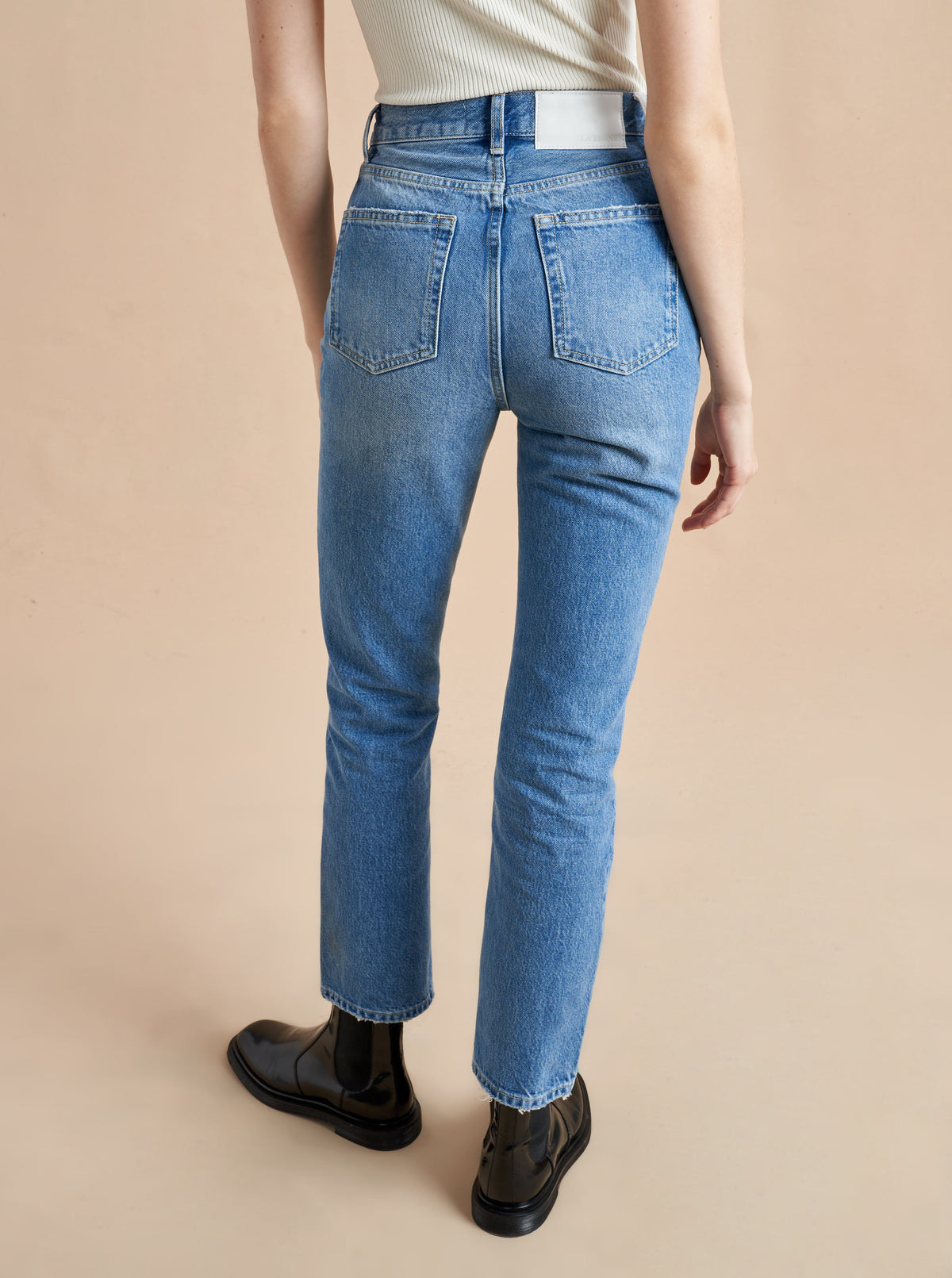 The classic, high-rise, non-stretch, straight-leg jean that gets better after each wear, never goes out of style, never disappoints and you can never get enough of, AKA The Molly jean or The Mom Jean, aptly named after our co-founder that will take you from 9 to 5, after hours and beyond. 