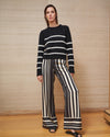 Our love for pull-up pants know no bounds. Wear this buttery-soft, silk charmeuse wide leg pants with a simple tee or be bold and wear it under the Isla Dress in matching black and white stripes. And let's face it, they double at the chicest pajama pants you have ever slept in. Bonne soirée!