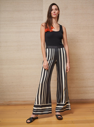 Our love for pull-up pants know no bounds. Wear this buttery-soft, silk charmeuse wide leg pants with a simple tee or be bold and wear it under the Isla Dress in matching black and white stripes. And let's face it, they double at the chicest pajama pants you have ever slept in. Bonne soirée!