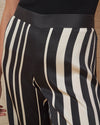 Our love for pull-up pants know no bounds. Wear this buttery-soft, silk charmeuse wide leg pants with a simple tee or be bold and wear it under the Isla Dress in matching black and white stripes. And let's face it, they double at the chicest pajama pants you have ever slept in. Bonne soirée!