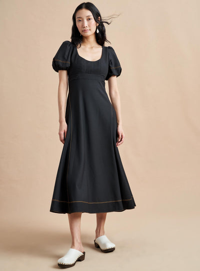Named after La Bande member and entrepreneur, Jennifer Rubio, this impossibly chic, wool-blend, fitted (don't worry, we smocked it at the back) bodice with trapunto stitching and a full skirt for full attitude.