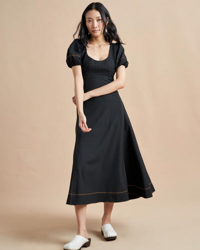 Named after La Bande member and entrepreneur, Jennifer Rubio, this impossibly chic, wool-blend, fitted (don't worry, we smocked it at the back) bodice with trapunto stitching and a full skirt for full attitude.