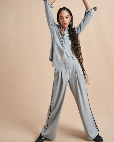 Inspired by La Bande member Selby Drummond, this grey, high waisted pleated trouser is elevated with a hint of sport. Feel free to run away with them in a flat boot or simply strut into a room when you wear them with heels. Just like Selby, there is nothing this pant can't do. 