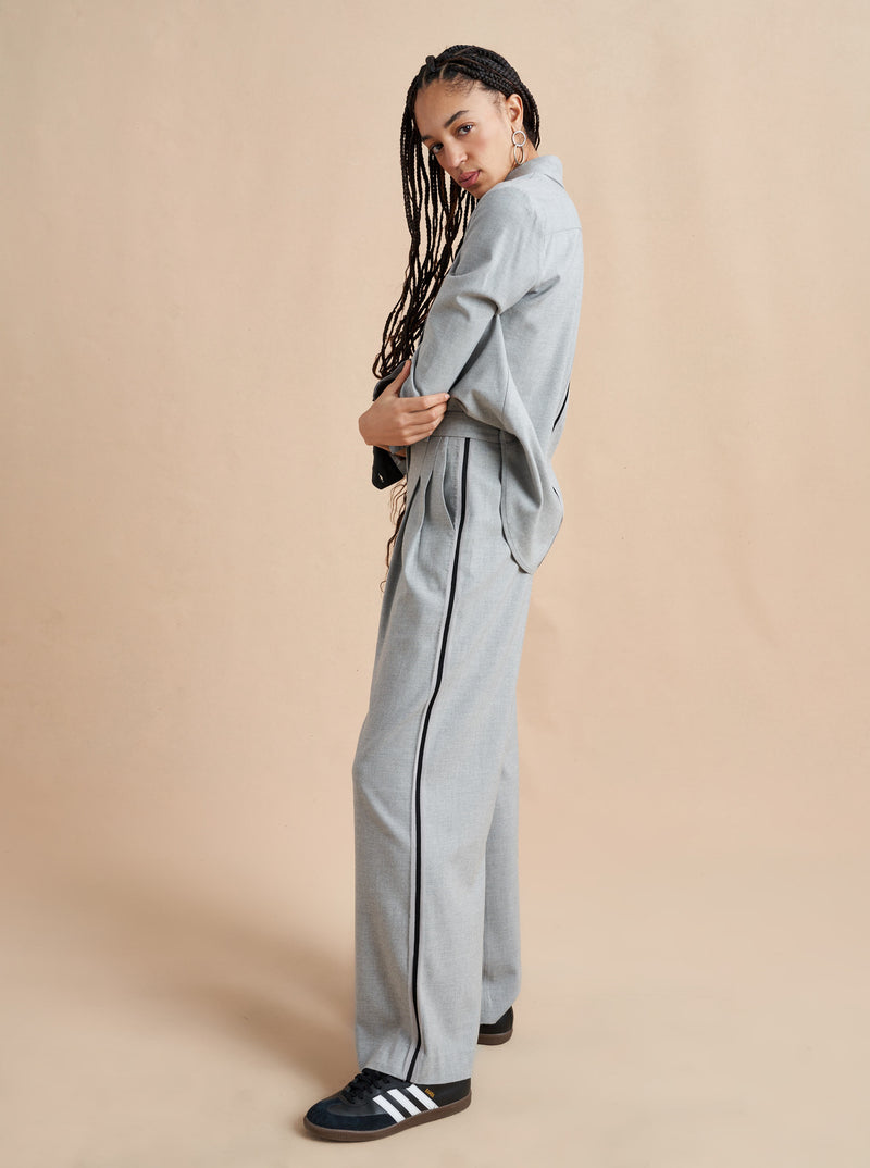 Inspired by La Bande member Selby Drummond, this grey, high waisted pleated trouser is elevated with a hint of sport. Feel free to run away with them in a flat boot or simply strut into a room when you wear them with heels. Just like Selby, there is nothing this pant can't do. 