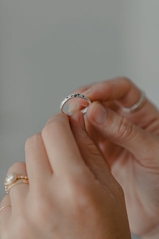 hands holding the finished ring design