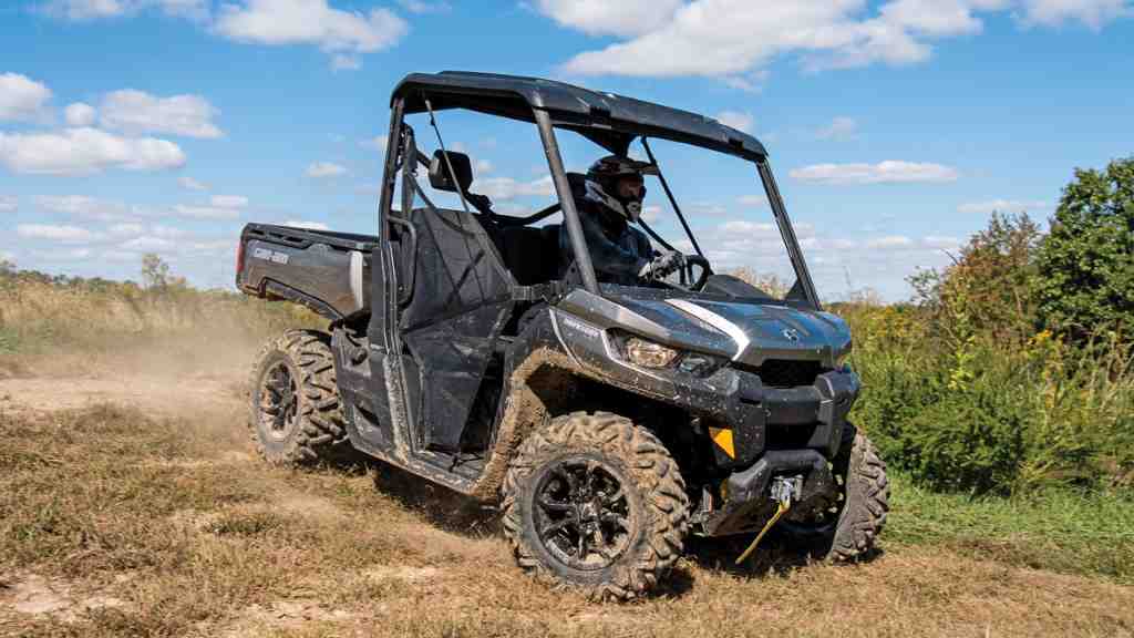 A Can-Am Defender is going downhill