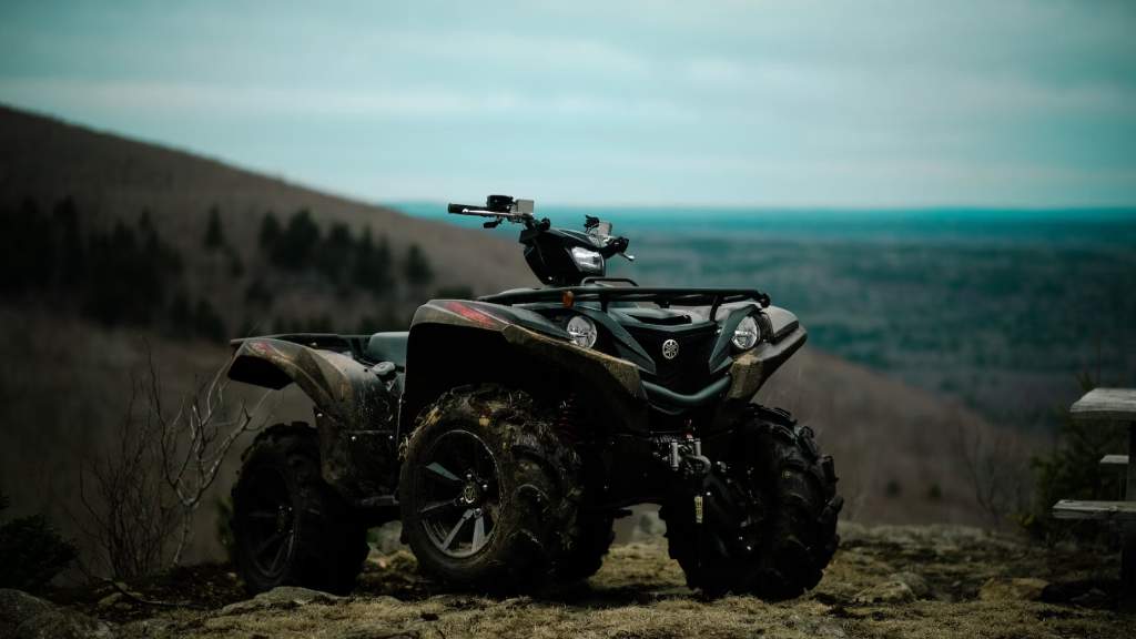 Hunting ATV Parked Atop Hill Ridge