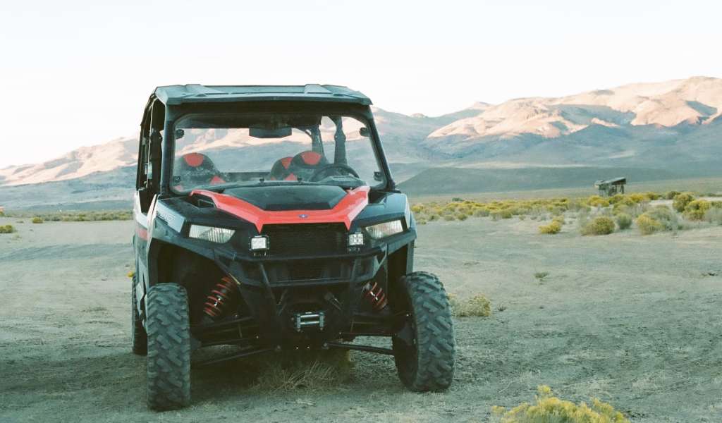 Polaris General Parked Against the Mountains