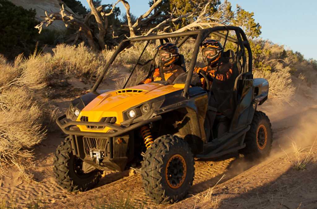 Two men riding Can-Am Commander