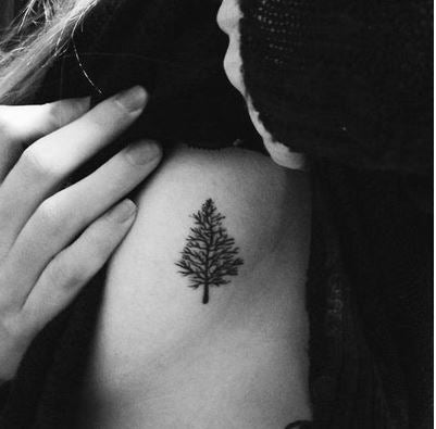 Fine line leafless tree tattoo on the side boob