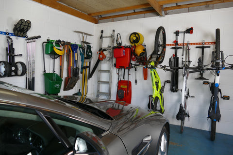 What is the best way to store garden tools in a garage?