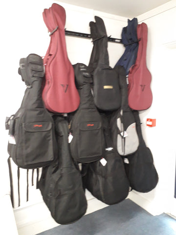 ukuleles stored on a wall in a school