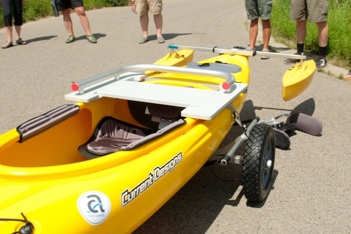 yellow kayak with several adaptions for people with disabilities