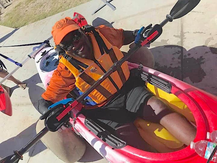 Johnny Holland gets outfitting to kayak with adaptive gear on-shore