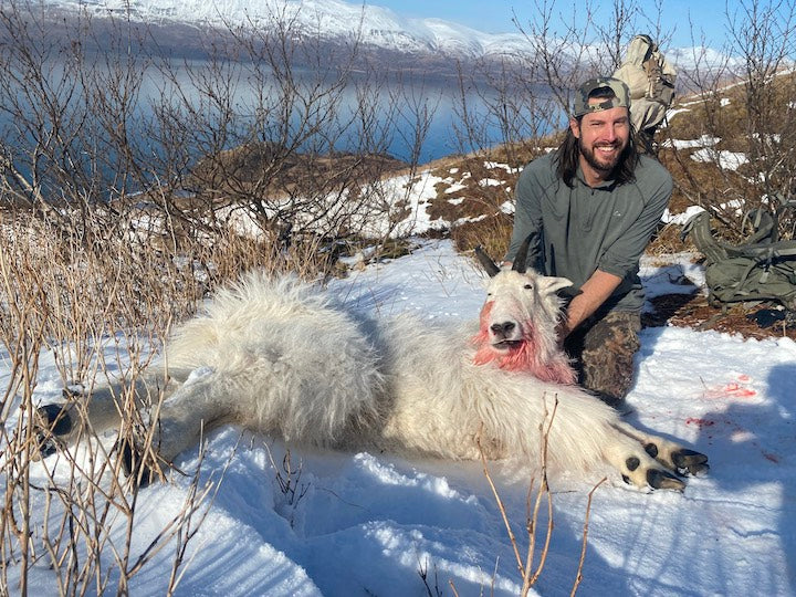 Josiah Pleasant with a mountain goat he hunted for its meat