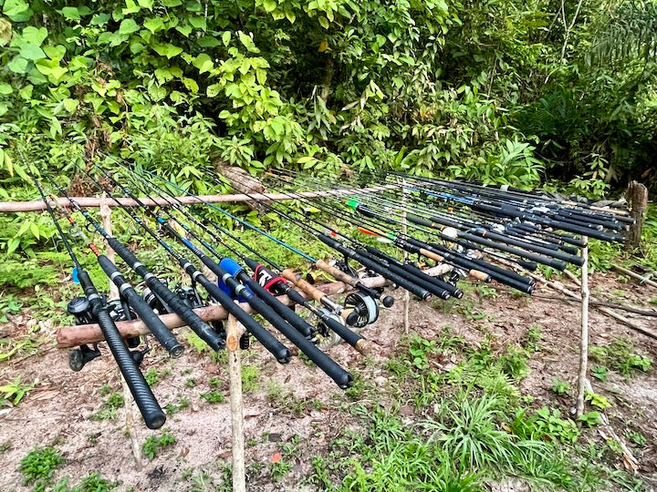 a couple dozen rods and reels lined up