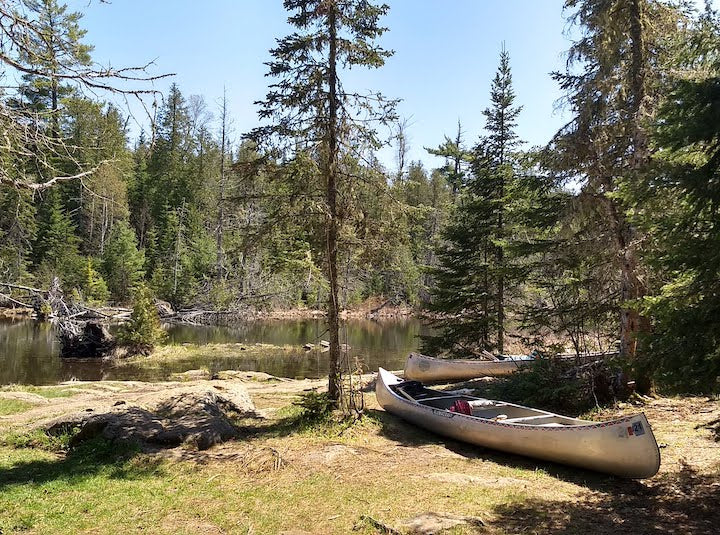 two canoes sitting at a portage