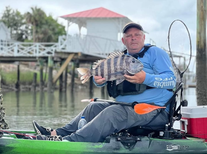 Bending Branches ambassador Dean Bowling in his fishing kayak with a nice fish