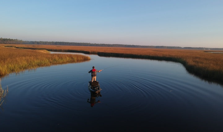 Jeff Jones fishes from his kayak at Bayou Cumbest, Mississippi