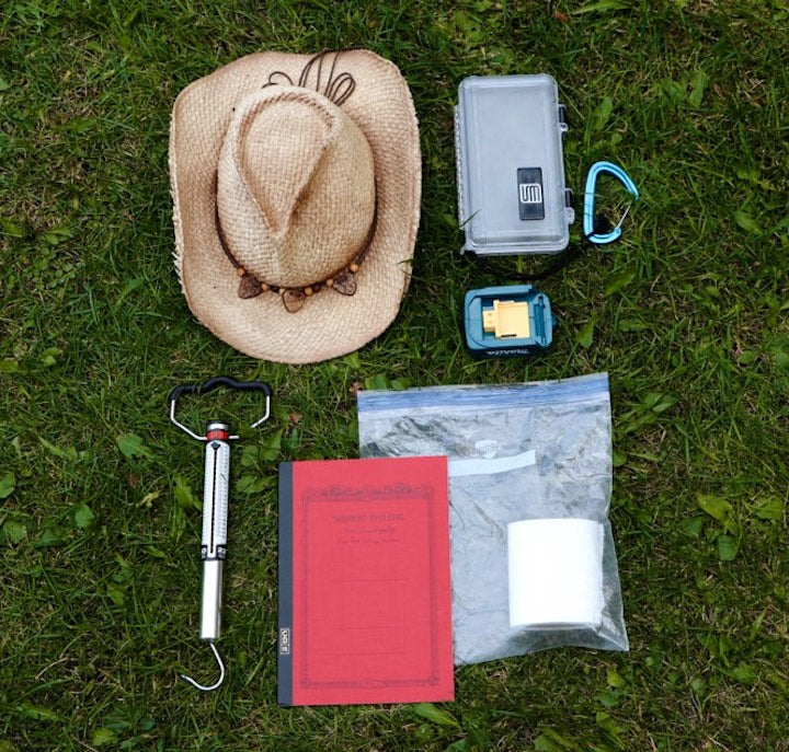 Ed's hat, fish scale, journal, cell phone box and other misc.