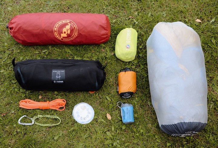 sleeping bag, tent, camp chair and canoe trip accessories