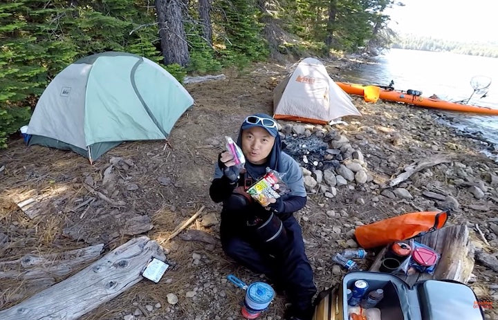 Moo Lee shows viewers his kitchen kit at a dispersed kayak campsite