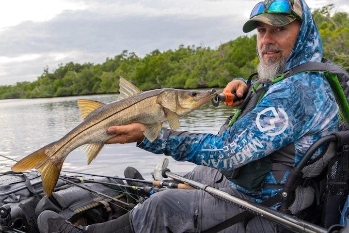 Bending Branches ProStaff team member, Chris Funk with a nice fish in his kayak
