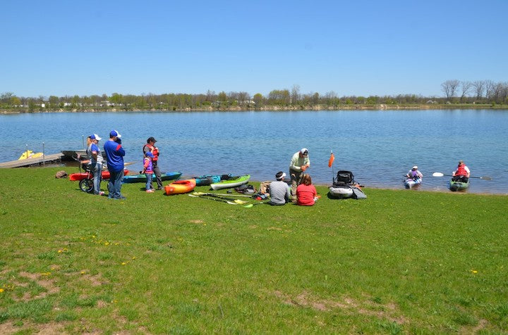 local demo day - adults and kids getting ready to kayak