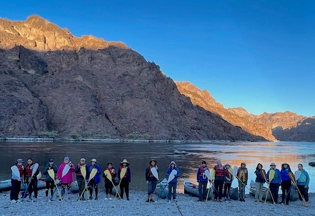 Girl Scouts San Diego troop and volunteers line up on shore, ready to canoe the Black Canyon