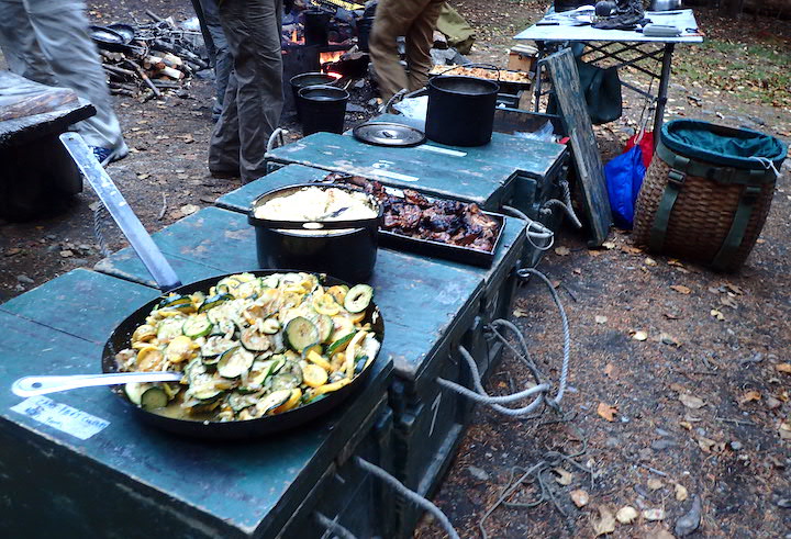 wannegans spread with loads of food aT a wilderness canoe trip campsite