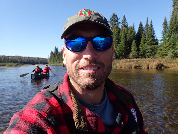 close-up of Scott Oeth, owner of Bull Moose Patrol, on a lake canoeing