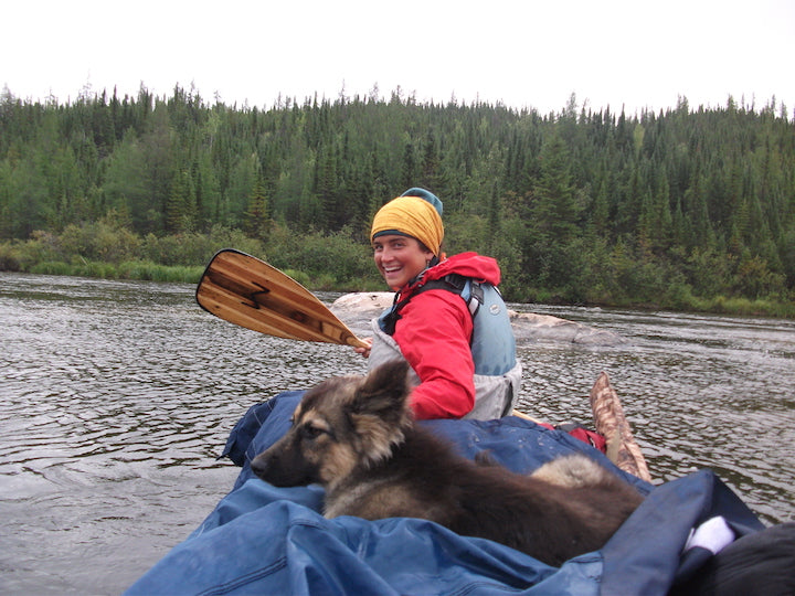 Natalie and dog in the loaded canoe