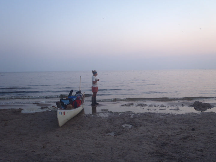 The girls and their canoe on the shore of Hudson Bay