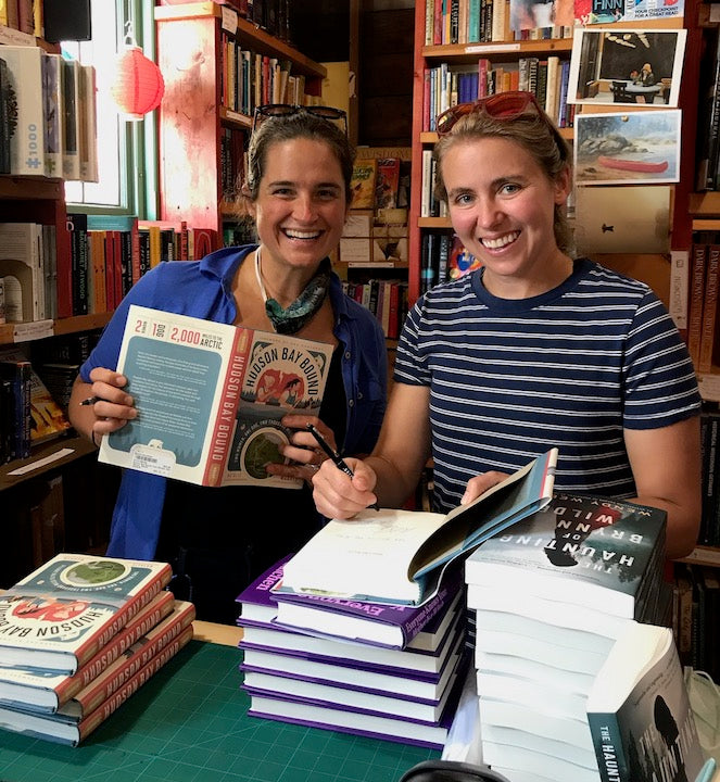 Natalie and Ann signing books in a bookstore