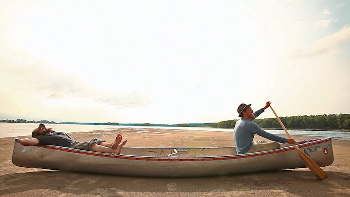 Okee Dokee bros press photo, in canoe on sand spit