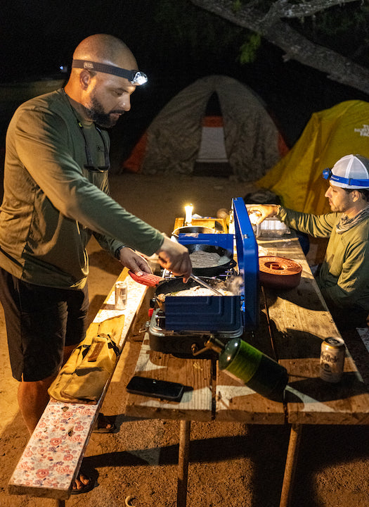 Terrell Hester cooks dinner for the group at their campsite