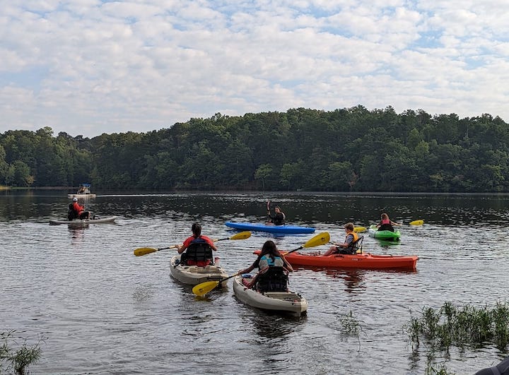 P4T participants kayak on a small lake