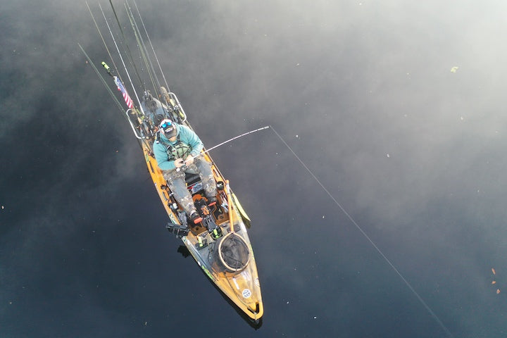 overhead view of man fishing in a kayak
