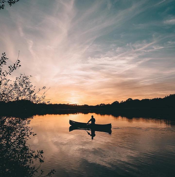 solo canoeist at sunset