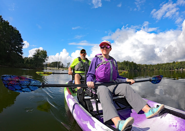 Chris and Angie Funk paddle a tandem fishing kayak