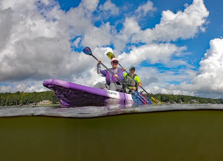 Angie and Chris Funk paddle a tandem fishing kayak