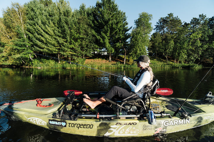 woman in a pedal kayak, fishing