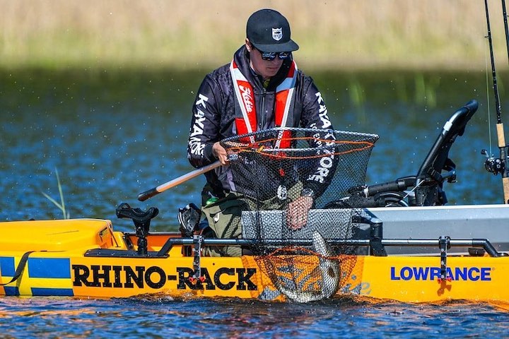 Bending Branches Ambassador Felix Frey lands a fish kayak fishing