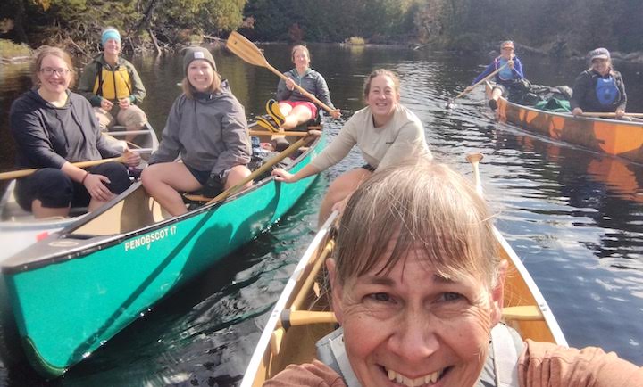 eight women in four canoes on a BWCA canoe trip