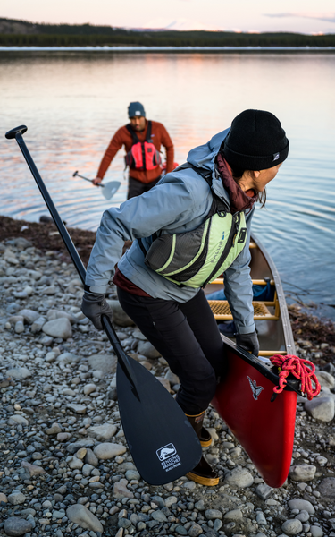 two people take out their canoe at a portage
