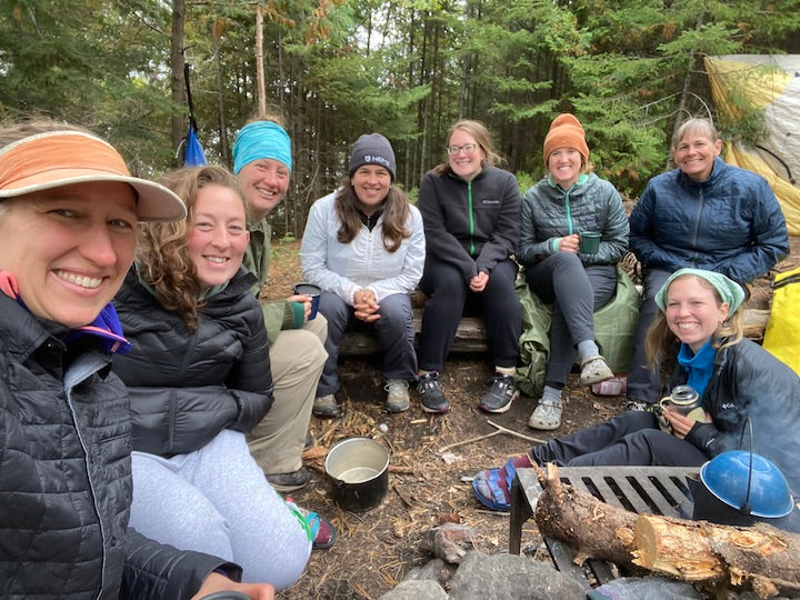 eight women at a Boundwar Waters campsite