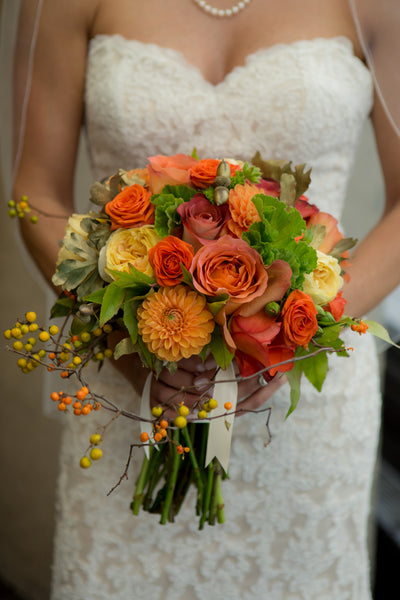 Bride displaying fall Bridal Bouquet