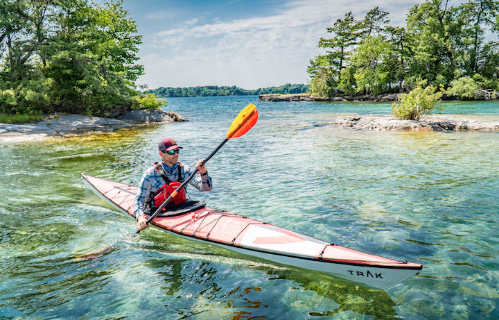 kayaker on clear beautiful water